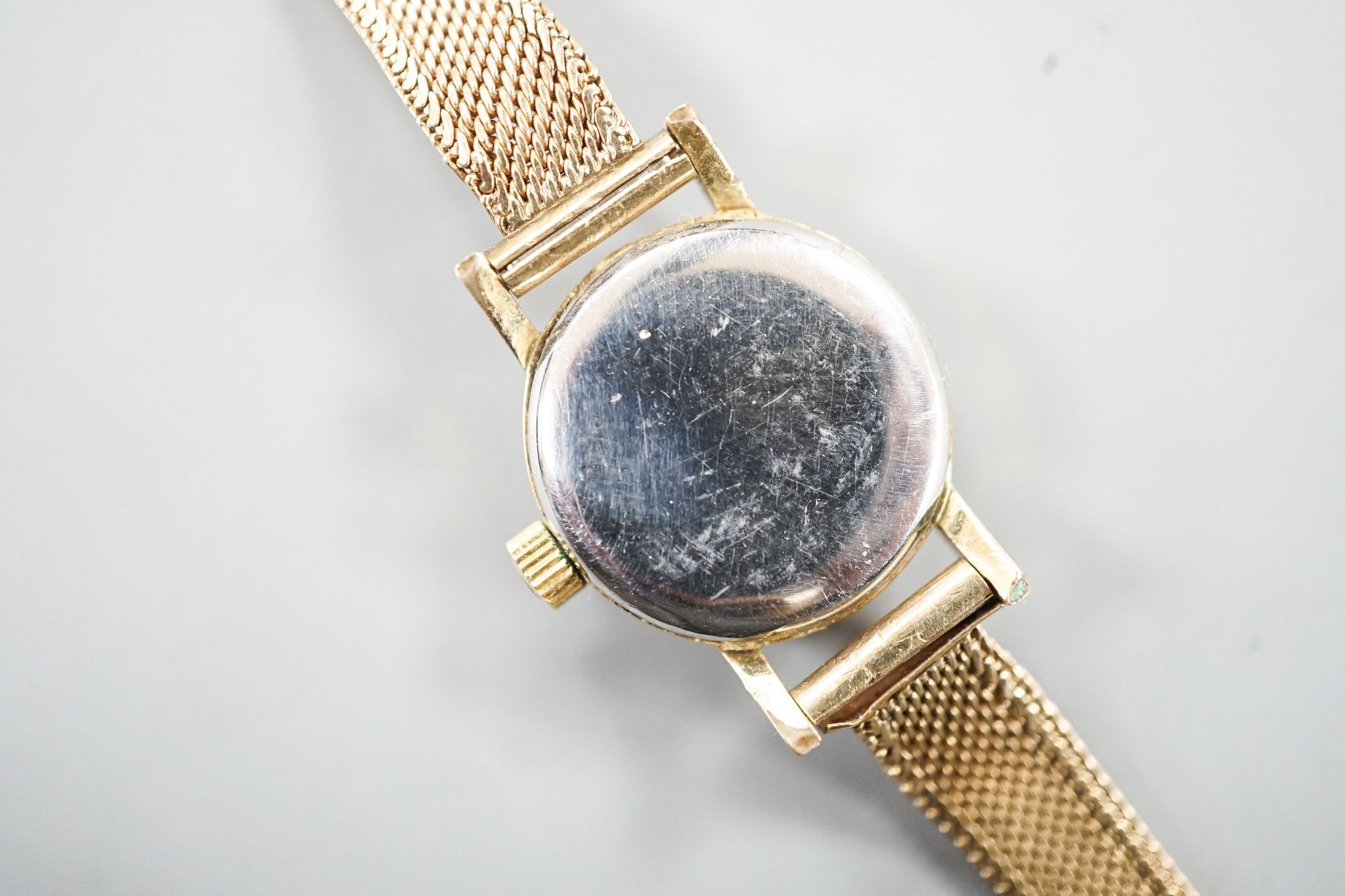 A lady's 1960's steel and gold plated Omega manual wind wrist watch, on an associated 9ct gold bracelet